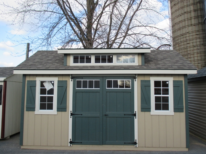 10x16 Transom Dormer Shed, Tan Duratemp siding, Dark Green/Navajo White trim, Weatherwood roof, OPTIONAL FEATURES, Higher Walls, Heavy Duty Floor, 6' Wide Doors, List Price $4,135.20, DISPLAY MODEL $3,721.68 Honey Brook